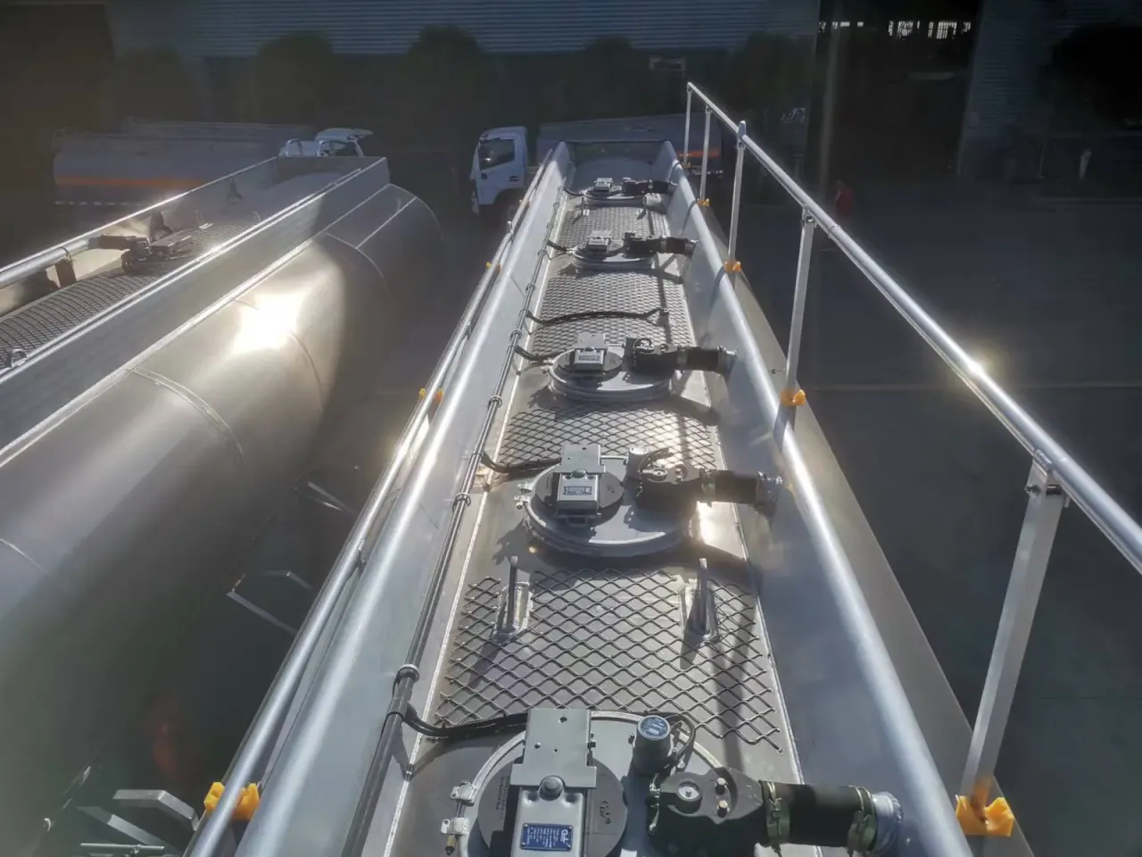 Top walkway and several manhole covers on a metallic tanker