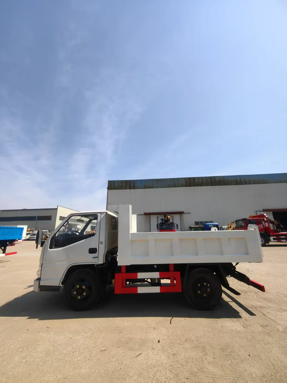 Raised dump body with visible clearance above the chassis