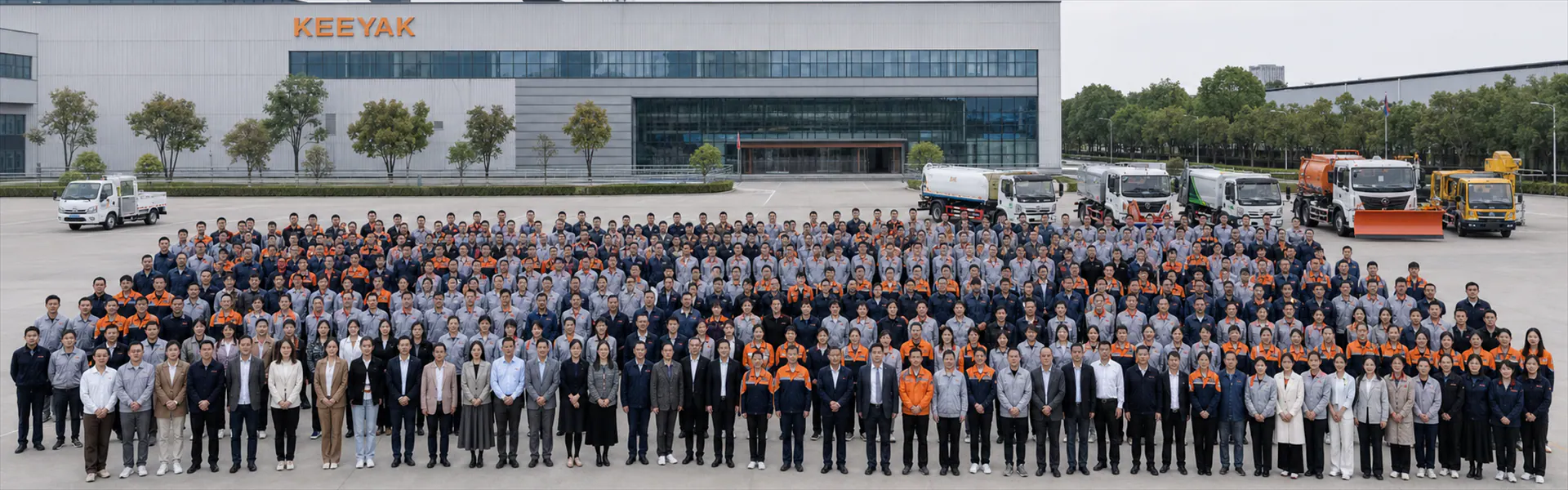 AI concept visualization of a large KEEYAK-wide team gathering outside a special vehicle manufacturing facility
