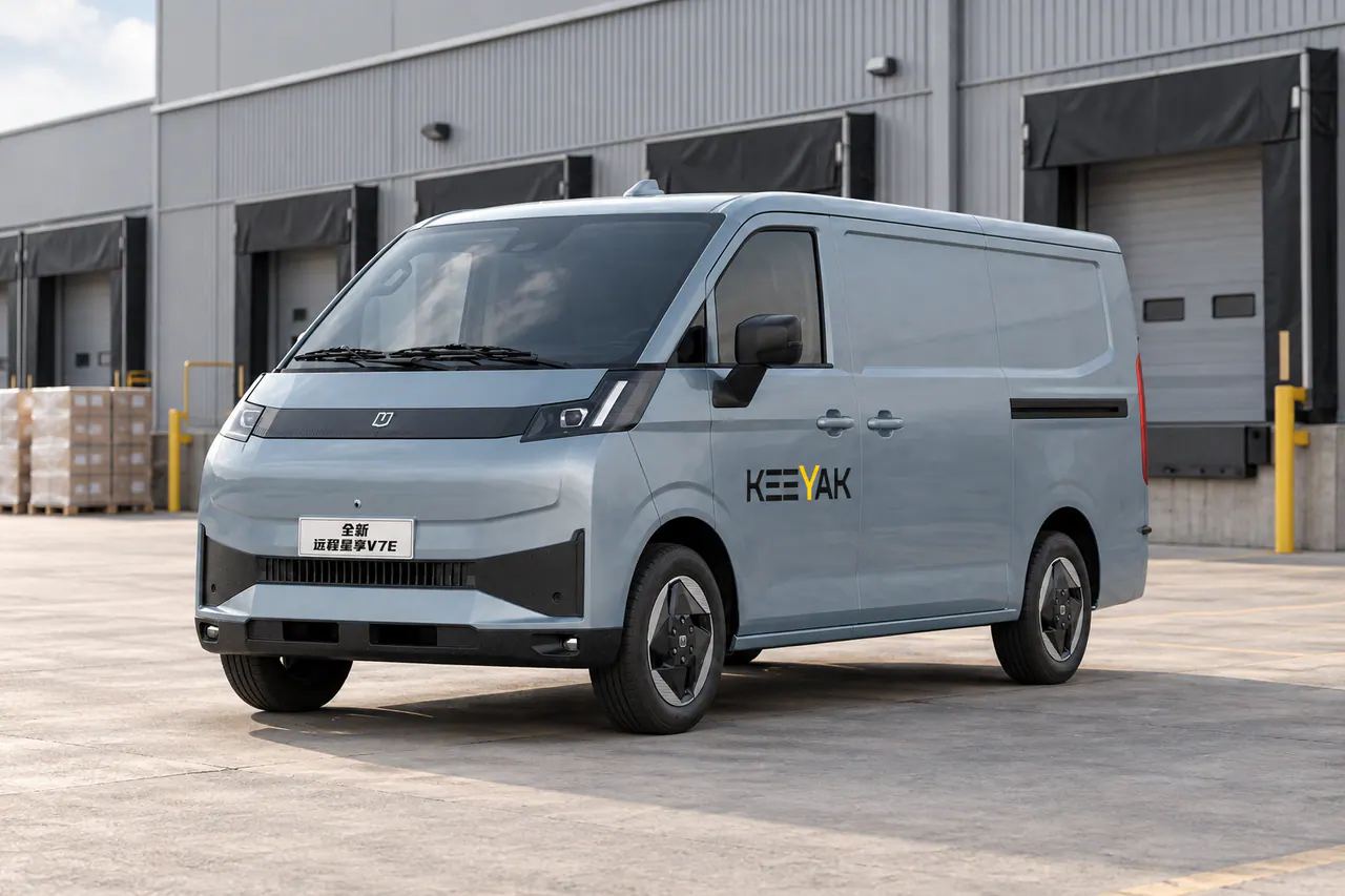 Gray and black electric commercial van viewed from the front left