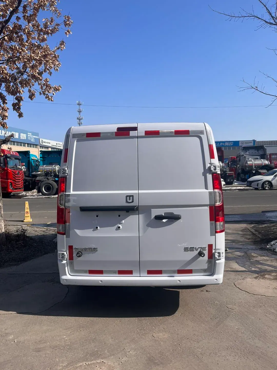 Rear view of a white van with two cargo doors