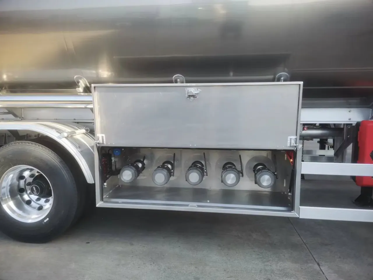 Open side compartment containing tanker valves and piping