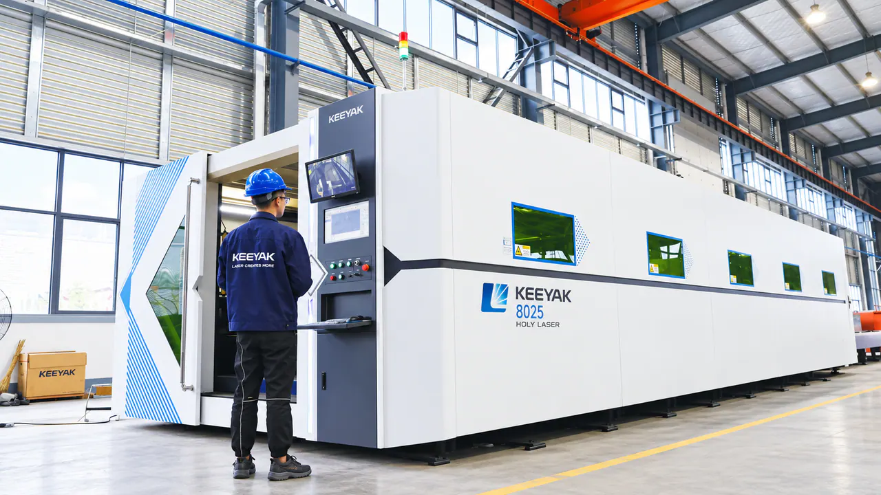 An operator at the controls of enclosed processing equipment.