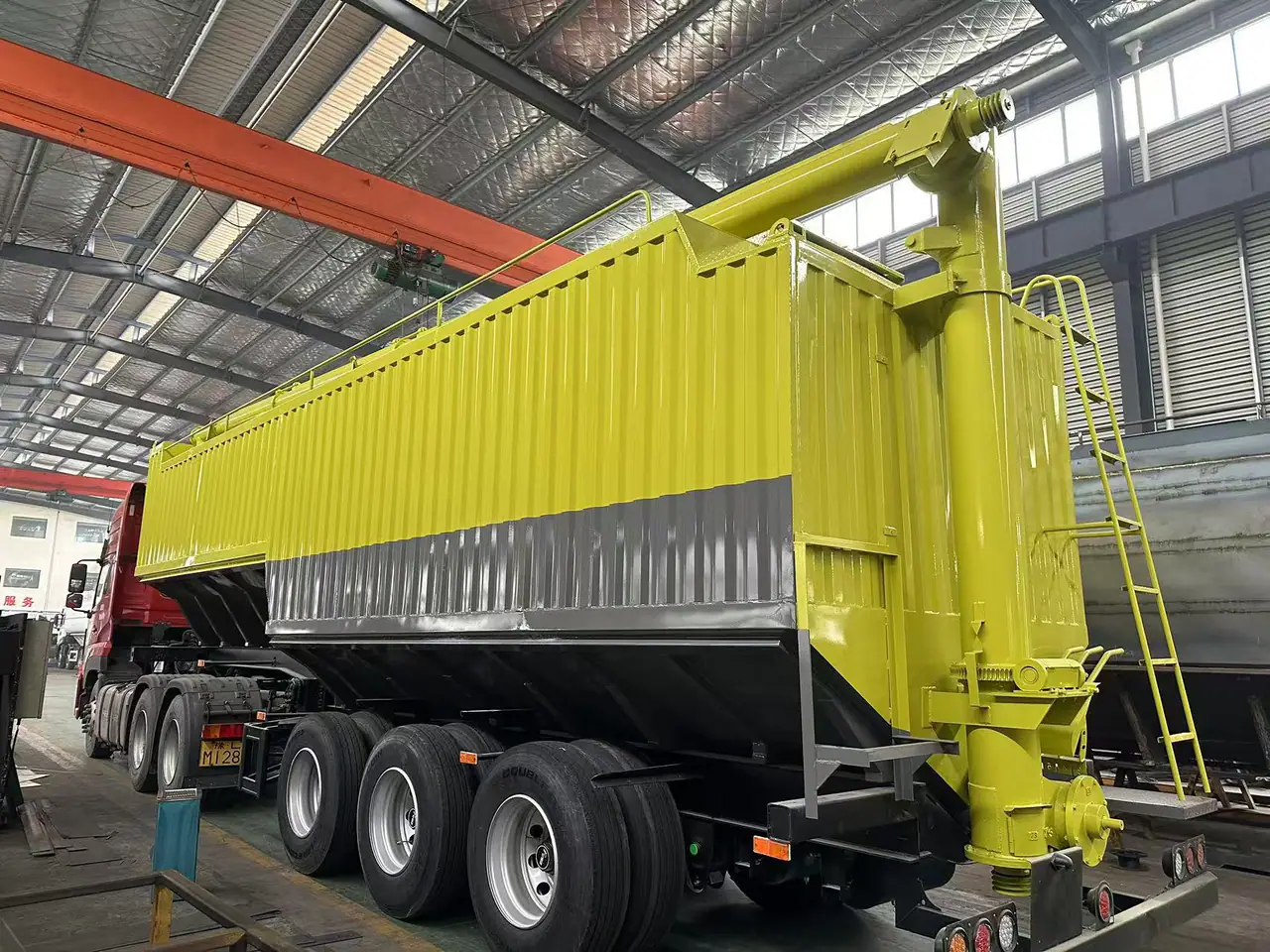 Rear auger and access ladder on the bulk feed semi-trailer