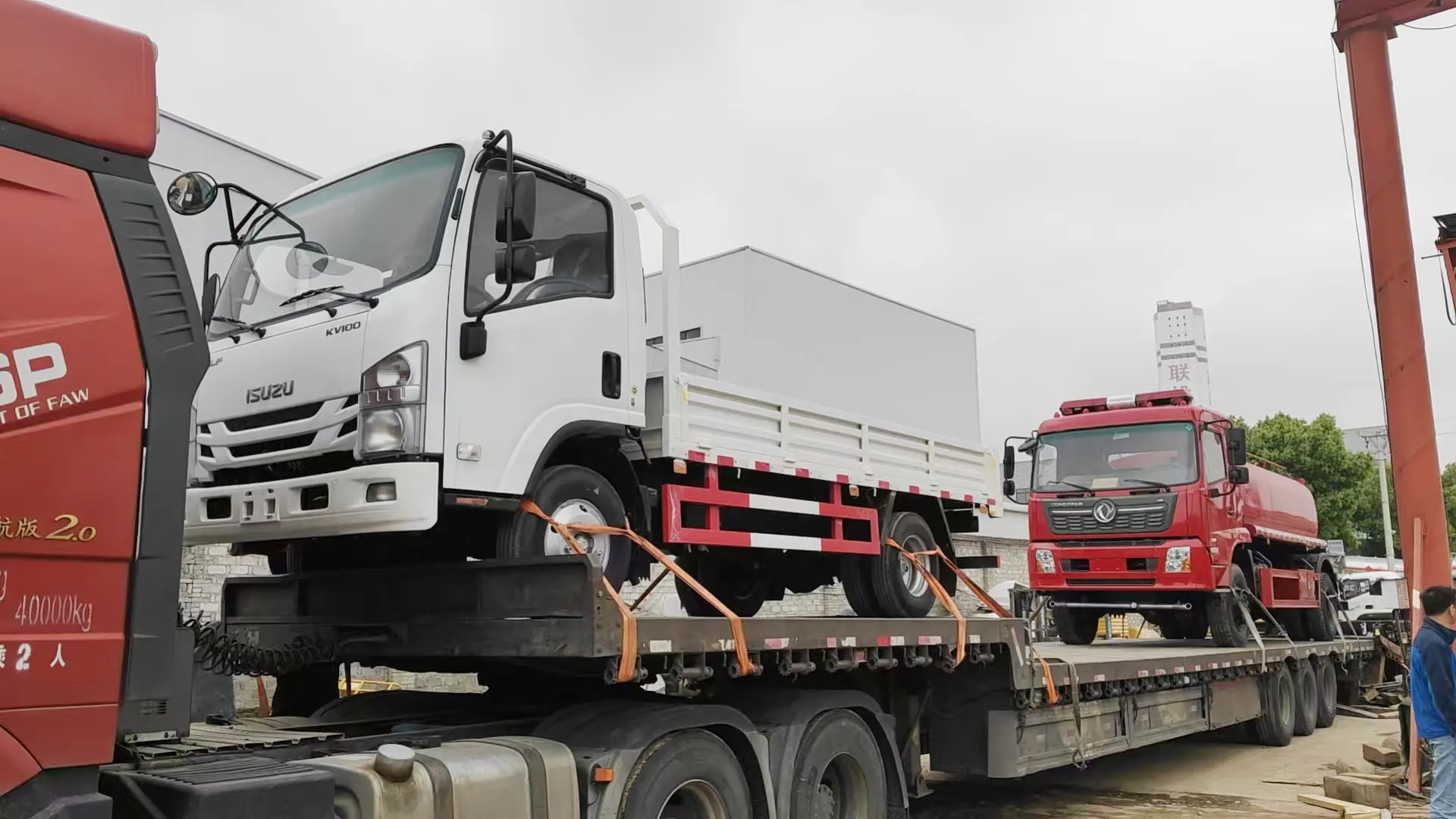 Completed special vehicles secured for export handover on a transport trailer