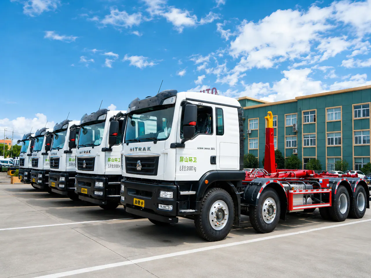 A lineup of white SITRAK chassis outside a special vehicle production facility