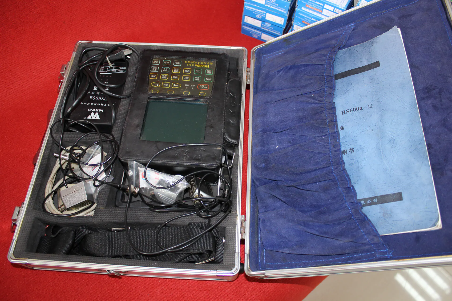 Ultrasonic testing instrument in a protective equipment case