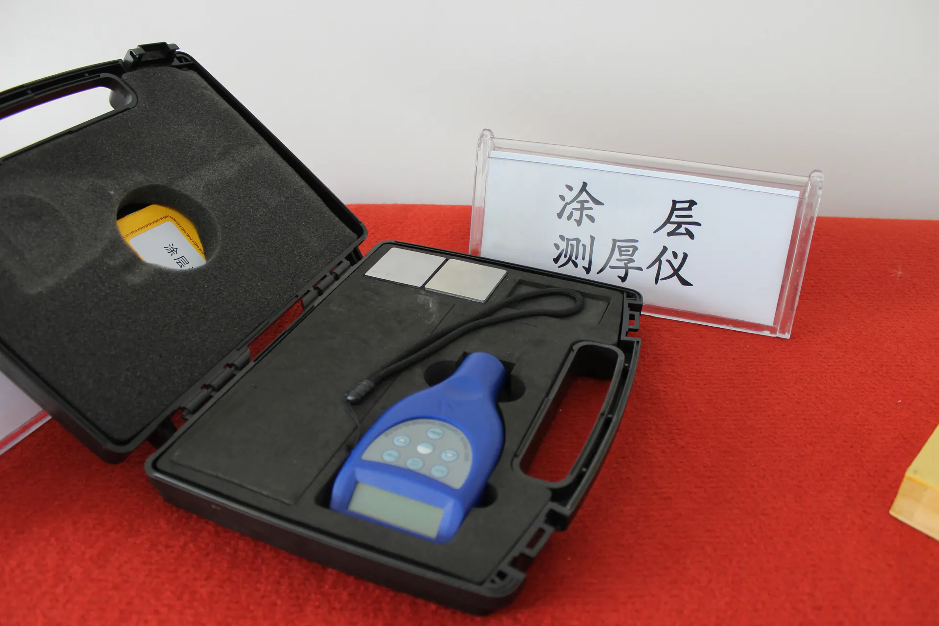 Coating thickness gauge and probe in a protective case