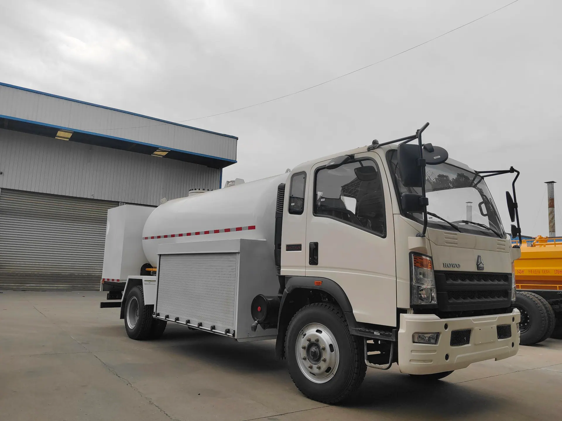 Front photograph of a real LPG dispensing truck in a factory yard