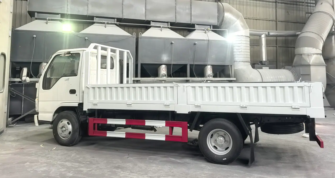 ISUZU 100P with its completed dropside body in the workshop