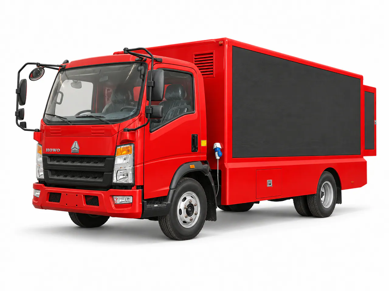 Red truck with a large black display panel on the side of its box body.