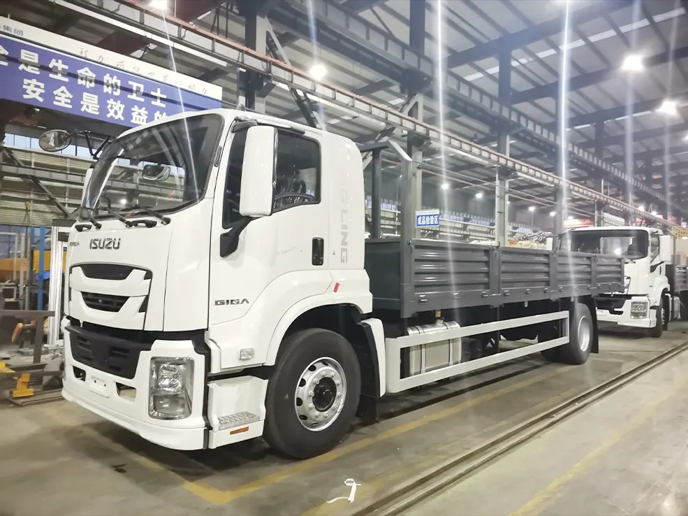 Finished Isuzu cargo truck awaiting inspection inside the factory