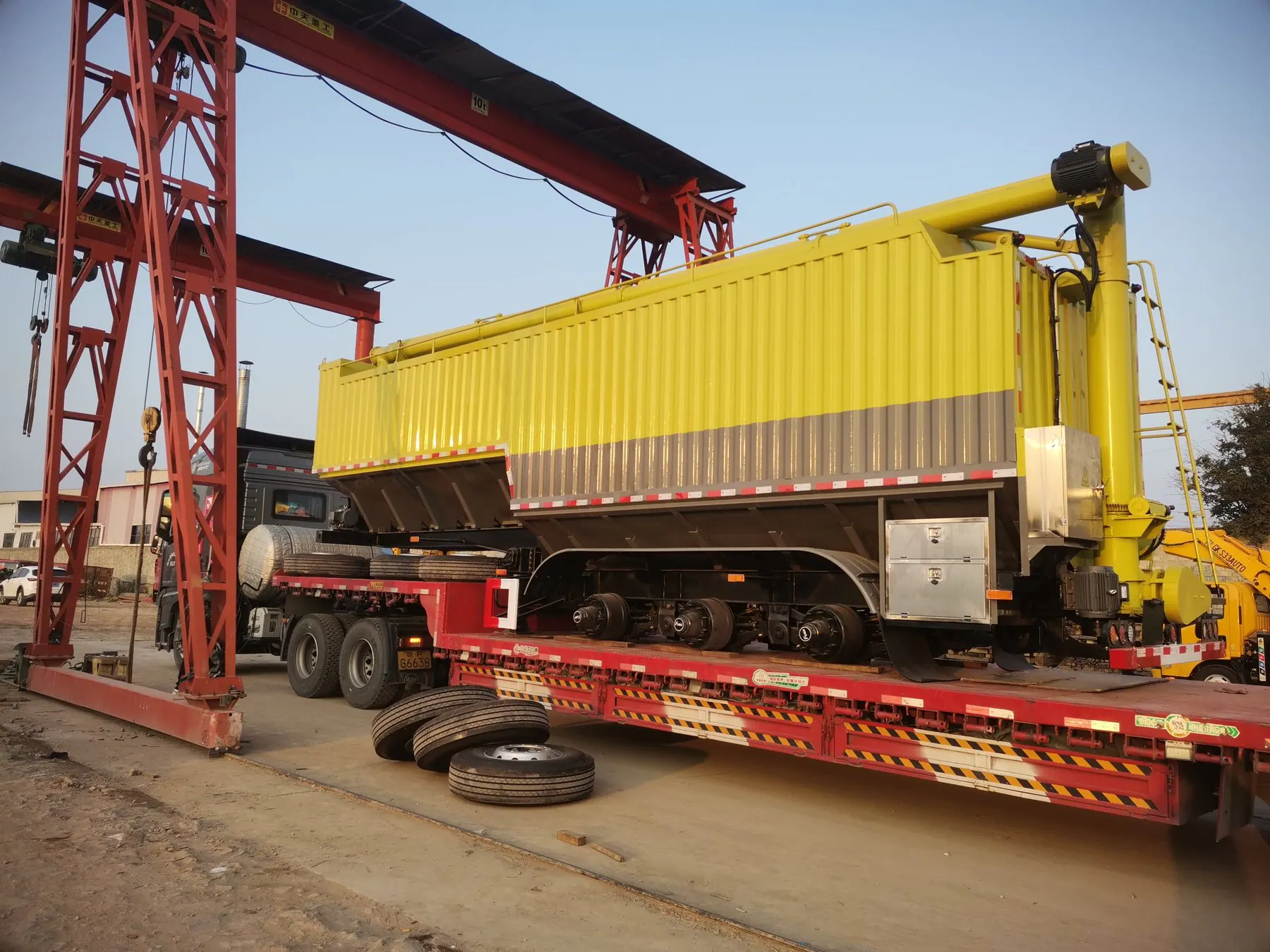 Special vehicle lifted onto a flat rack for export loading